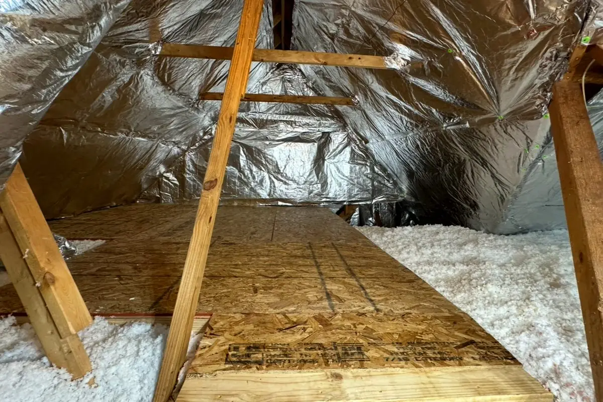 Attic after: reflective insulation and fresh white blow-in
